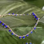 Αλυσίδα ποδιού χρυσή με χάντρες μπλε