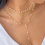 Διπλό κολιέ με λευκές χάντρες σε χρυσό