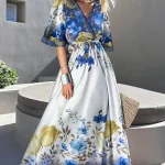 Φόρεμα μπλε μάξι κρουαζέ με φλοράλ σχέδιο και ζώνη